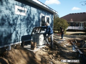 Jeannie preparing a 20 Kw, whole house generator for hook up.